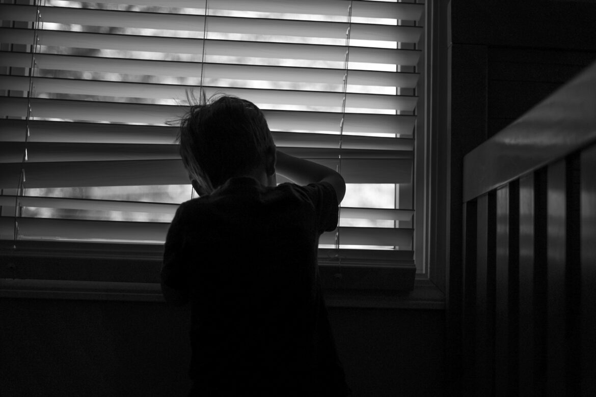 Silhouette of a child at a window