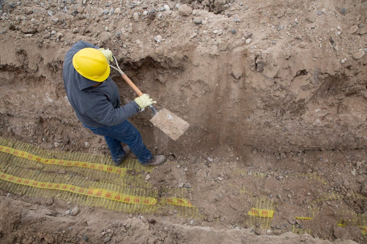 Construction worker digging